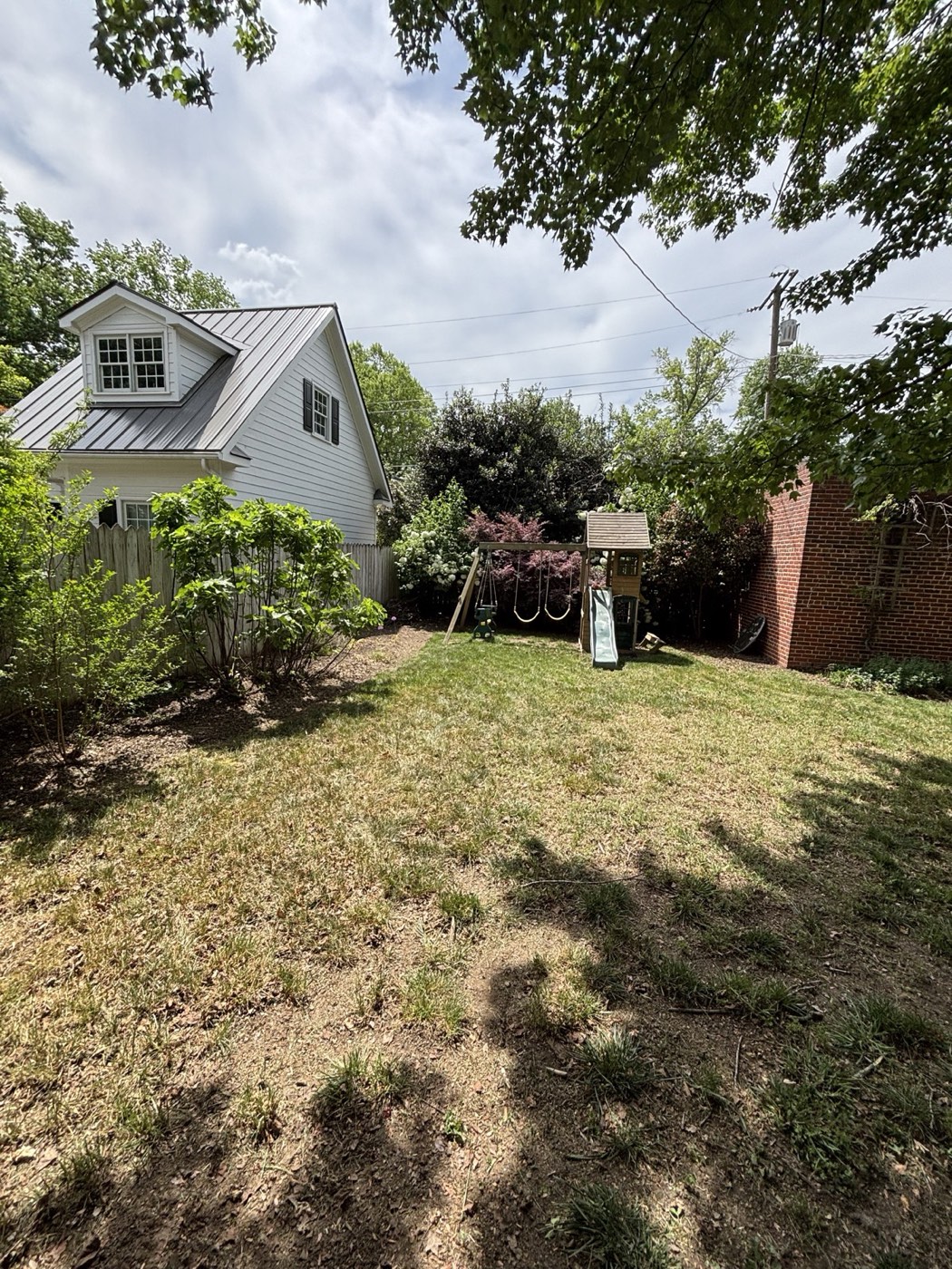 Side lawn weeded and mowed after cleanup
