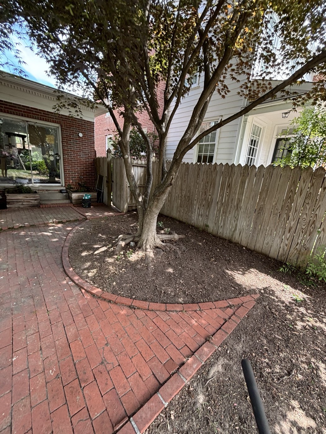 Brick patio cleared of debris after cleanup