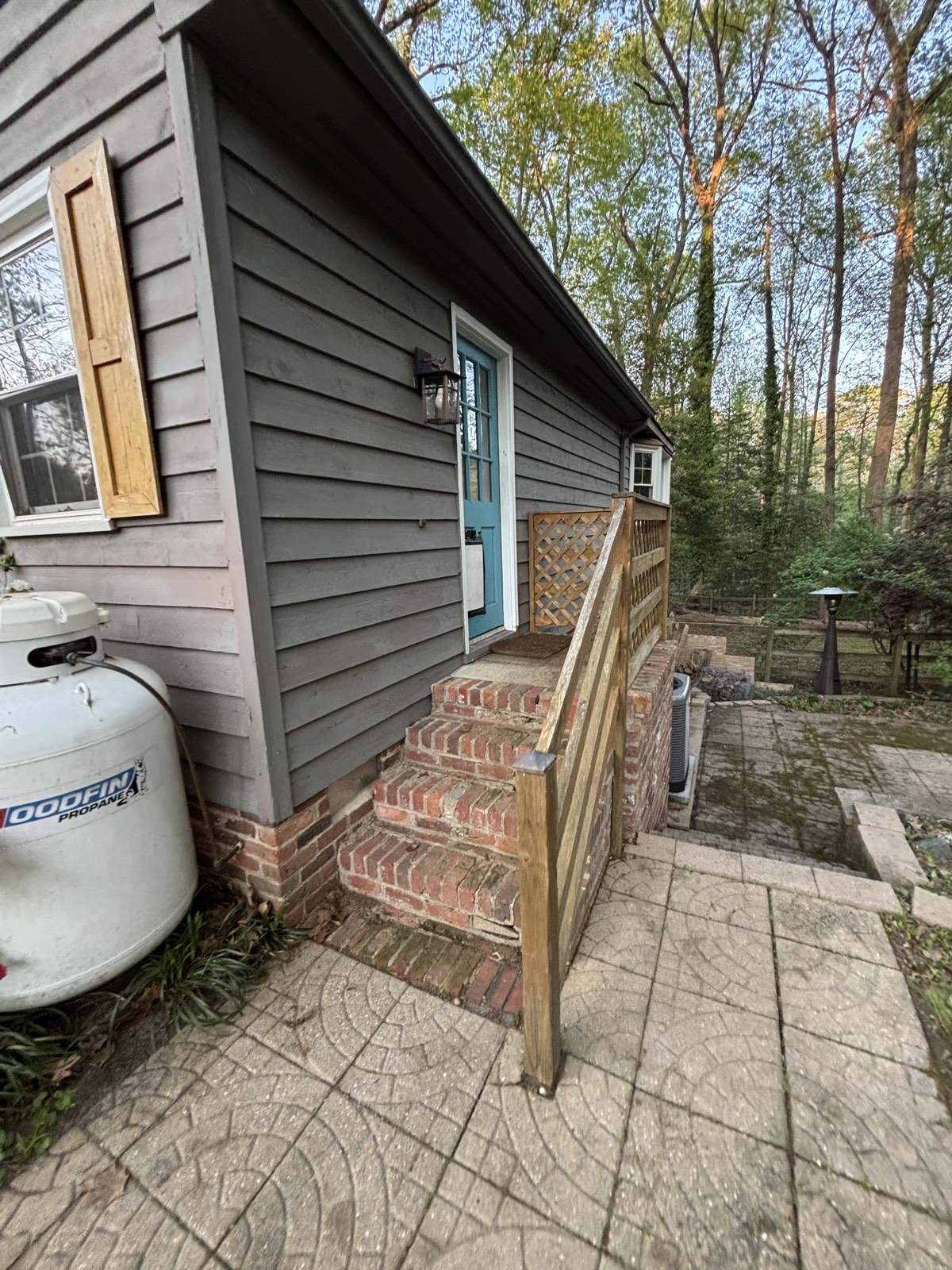 Side entrance with brick steps after cleanup